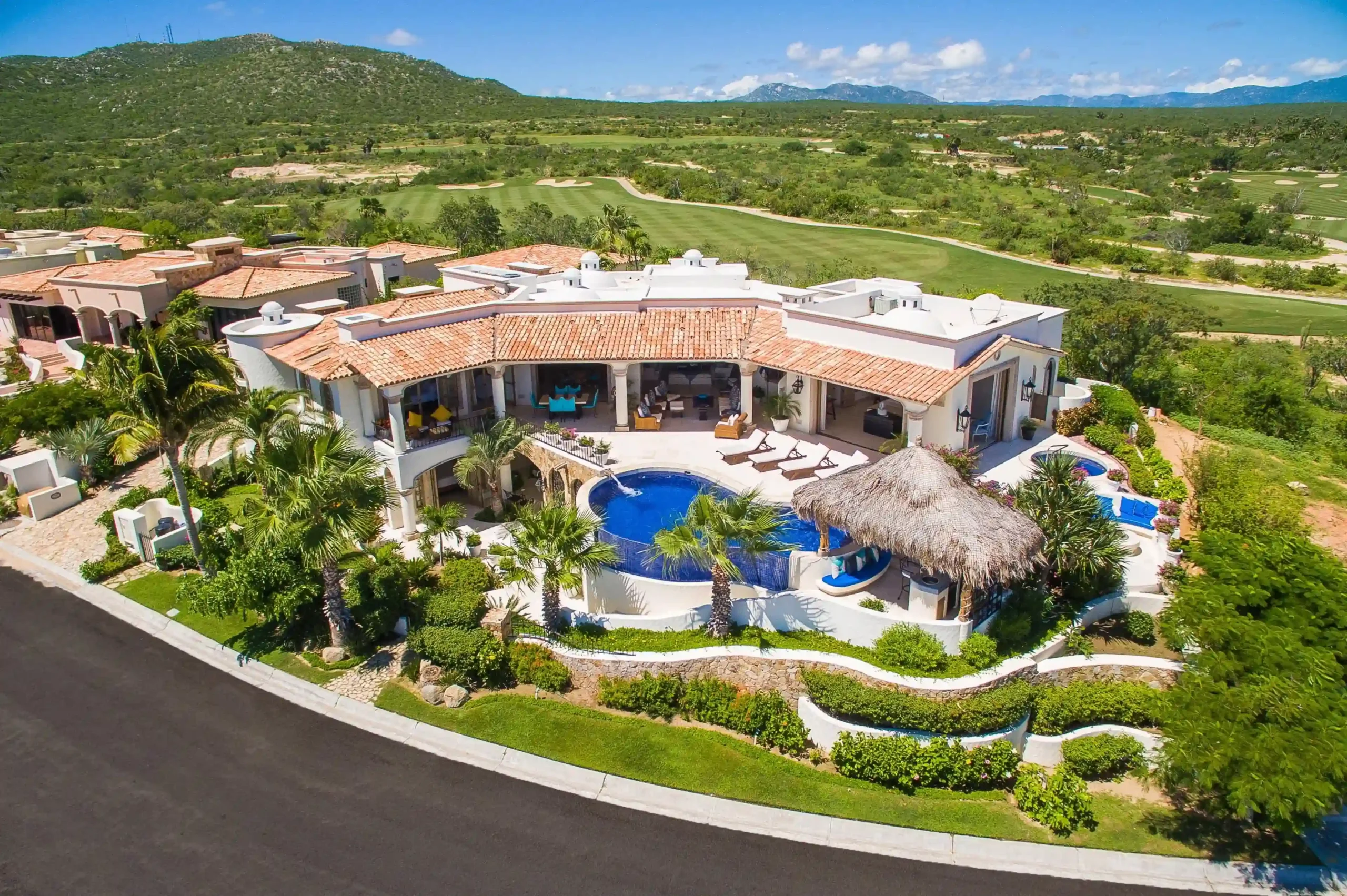 Modern Homes in Cove Club for Sale featuring contemporary oceanfront estate with glass architecture and private club setting